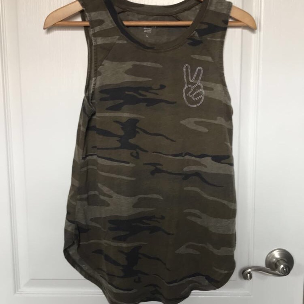 Camouflage tank top with hand peace sign on chest.